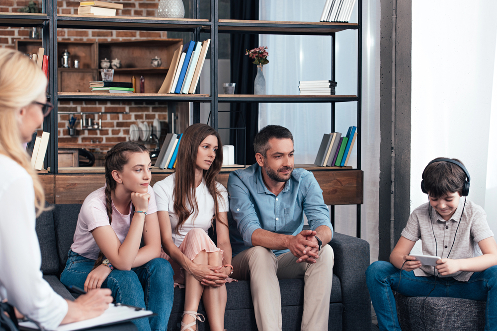group therapy photo, men and women in a group therapy and mental health and wellness session